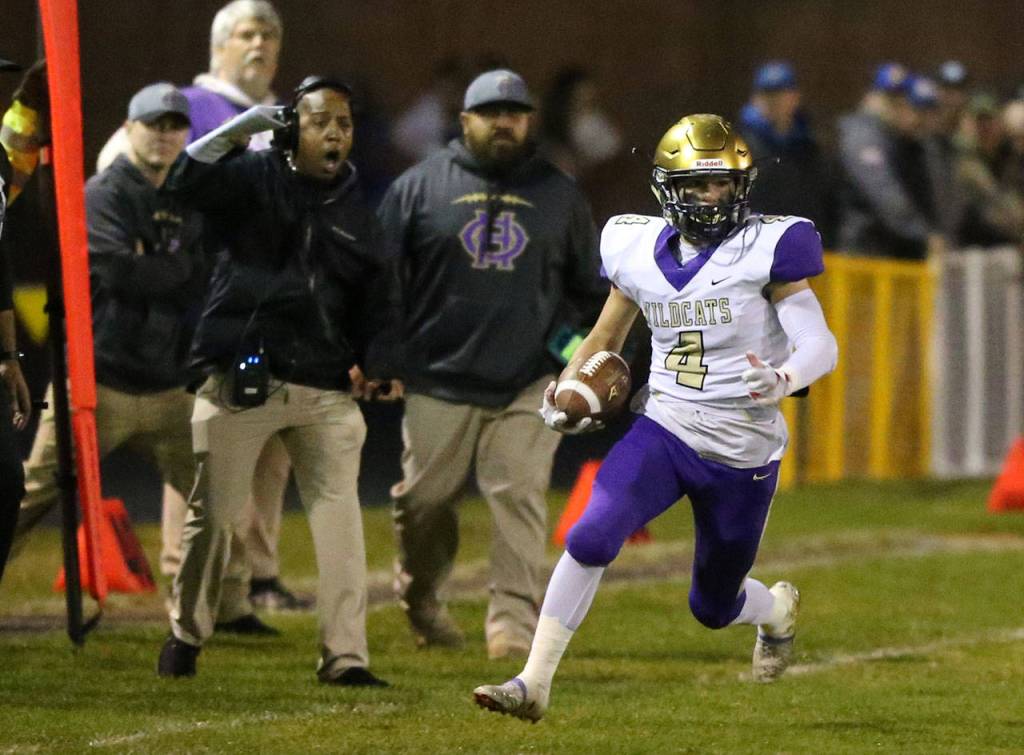 Landon Contrell heads up the sideline for a big gainer.(Photo by John Fisken)