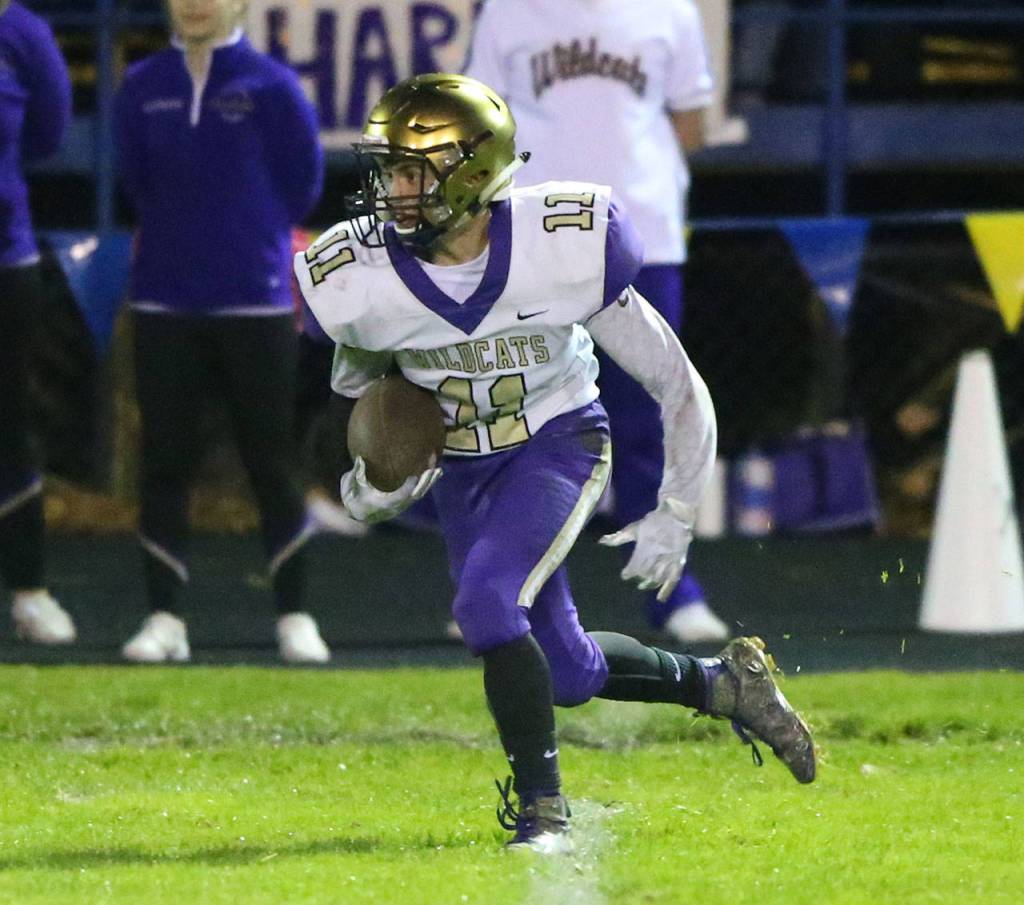 Luke Golden returns a kick for the Wildcats.(Photo by John Fisken)