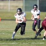 Ben Smith runs through a huge hole created by his offensive line.(Photo by John Fisken)