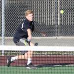 Mason Grove flips a backhand shot over the net.(Photo by John Fisken)