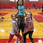 A trio of youngsters perform a stunt at the Coupeville Cheer Camp Sunday. (submitted photo)