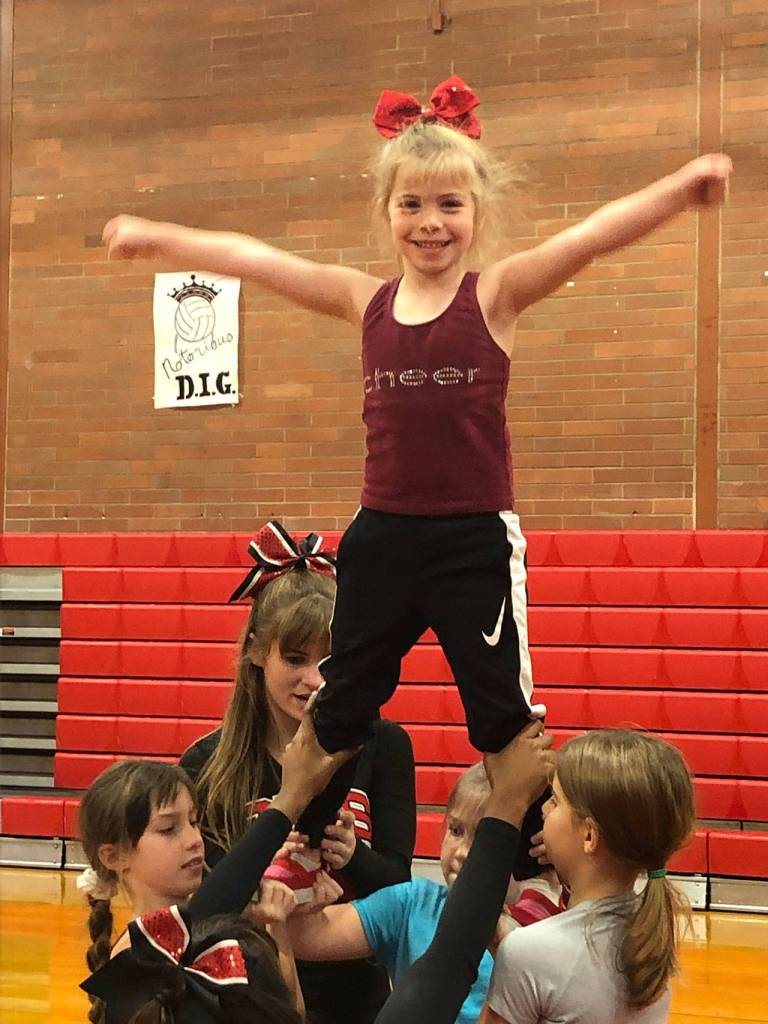 Island youth spread their spirit at camp / Cheer