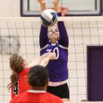 Morgan Pease rises to block for the Wildcats.(Photo by John Fisken)