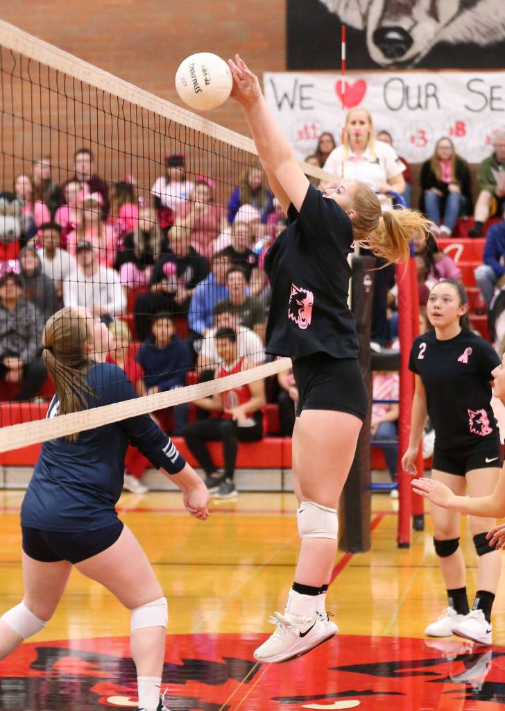 Hannah Davidson puts up a block for Coupeville.(Photo by John Fisken)