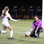 Oak Harbor goalkeeper Tiana Jackson scoops up a Stanwood shot. Jackson moved to the front in the second half and scored both Oak Harbor goals.(Photo by John Fisken)