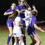 Chloe Wallace heads the ball in traffic for Oak Harbor.(Photo by John Fisken)