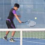 Yuji Caballero returns a shot Monday.(Photo by John Fisken)