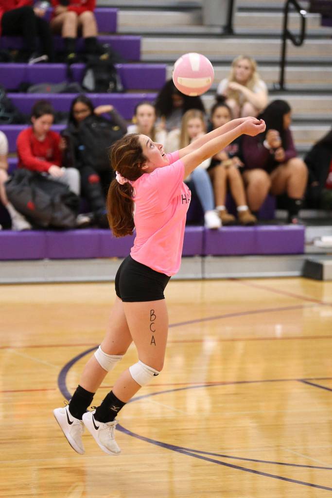 Annie Salinger uses a pass to set up one of her teammates. (Photo by John Fisken)