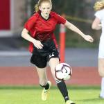 Anna Dion run down the ball for the Wolves.(Photo by John Fisken)