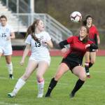 Coupevilles Carolyn Lhamon, right, battles for possession in Tuesdays match with Sultan.(Photo by John Fisken)