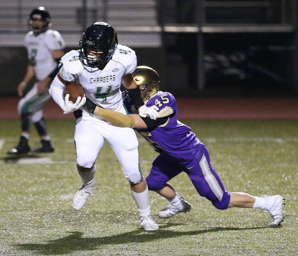 Caden Leckelt throws Getchells Landyn Olson for a loss.(Photo by John Fisken)