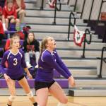 Payton Parks passes as Lacey Zylstra (3) looks on.(Photo by John Fisken)