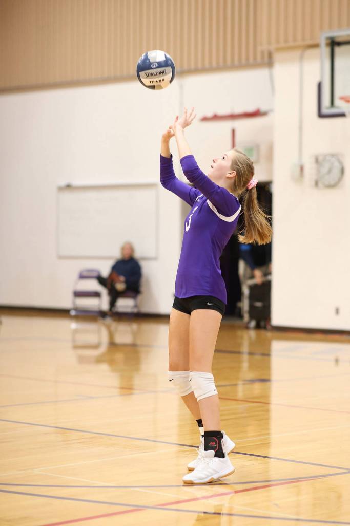 Lacey Zylstra gets the offense started with a set.(Photo by John Fisken)