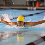 Casey Cabigting competes in the 100-meter butterfly for Oak Harbor in Tuesdays meet. (Photo by John Fisken)