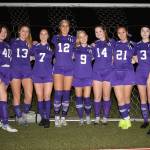 Oak Harbor celebrated Senior Night with an upset over Arlington. The Wildcat seniors are Morgan Lamar, left, Natalie Plush, Gracie Hiteshew, Mikhaela Cortez, Rebecca Blazich, Peyton Rhyne, Chihiro Hoover and Bryanna Scott. (Photo by John Fisken)
