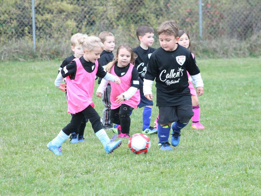 While the Coupeville High School soccer team was competing on the adjacent field, future Wolves were enjoying their own match. (Photo by Jim Waller/Whidbey News-Times)