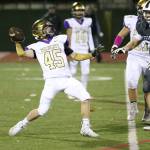 Caden Leckelt throws a halfback pass for a 75-yard TD.(Photo by John Fisken)