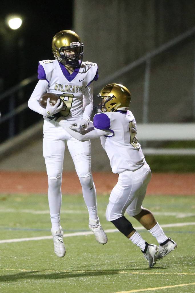 Will Rankin, left, and Dominic Dean celebrate a touchdown.(Photo by John Fisken)