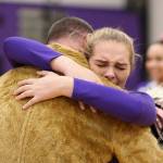 Payton Parks hugs her father, who came home early from deployment. He surprised her by wearing the Wildcats mascot costume.(Photo by John Fisken)