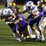 Gabriel Daggett (28) and Dominic Dean bring down Nooksack Valleys Scout Whittern.(Photo by John Fisken)