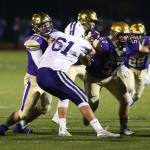 Oak Harbors Jackson Higman (72) and Justin Campbell block the Pioneers Easton Zylstra.(Photo by John Fisken)