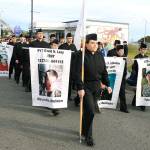 Oak Harbor High School Navy JROTC marches downtown Monday afternoon at the annual Veterans Day Parade.