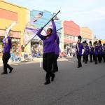 The Oak Harbor High School color guard and marching band make their way through downtown Oak Harbor Monday afternoon at the annual Veterans Day Parade.