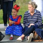 Ayvakaye Whitehurst admires a piece of candy she received during the Oak Harbor Veterans Day Parade. She attended with her mother Lanette Whitehurst.