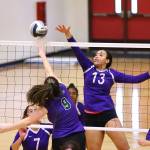 Oak Harbors Jasmine Ford (13) battles at the net with Edmonds-Woodways Grace Lewis (9).(Photo by John Fisken)