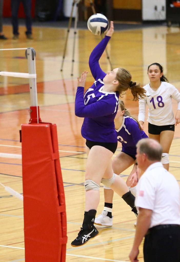 Emily Lamb hits for Oak Harbor in the E-W match.(Photo by John Fisken)