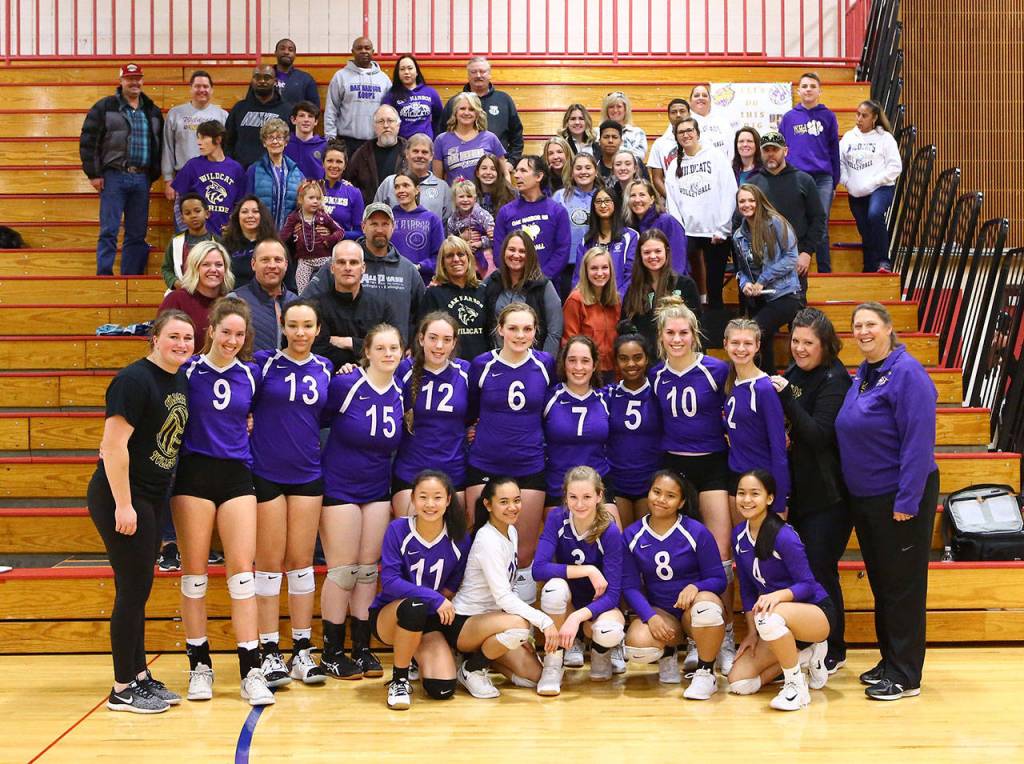 The Wildcats pose in front of their fans after the win over E-W.(Photo by John Fisken)