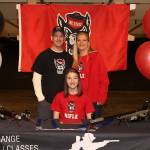 Lauren Crossley is joined at the signing ceremony by her parents Troy and Jen Crossley. (Photo by John Fisken)