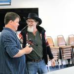 Jason Blaszkowski, left, and Shawn Cain share a moment during a shoot for their show Scared Stiff. Photo by Laura Guido/Whidbey News-Times