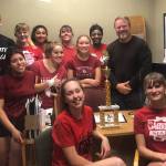 The Coupeville cheerleaders share their regional trophy with Athletic Director Willie Smith. (submitted photo)