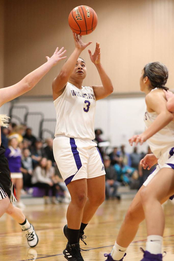 Oak Harbors Tiana Jackson launches a shot in the win over Coupeville.(Photo by John Fisken)