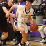 Oak Harbor Gage McLeod, right, gets by the defense of Koa Davison.(Photo by John Fisken)