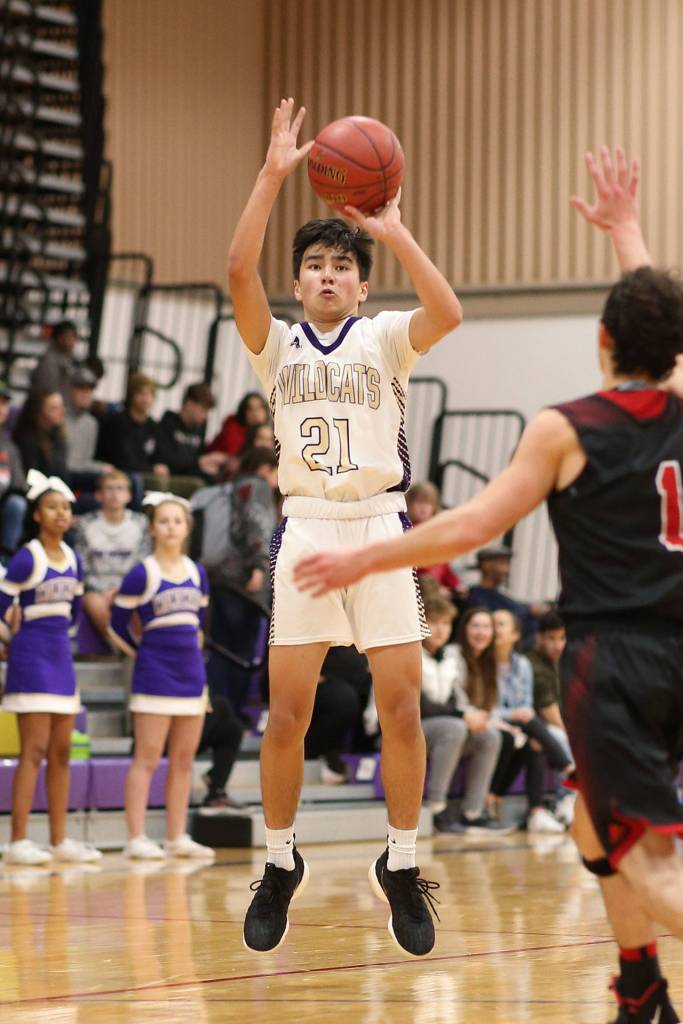 Kaito White launches a shot for Oak Harbor.(Photo by John Fisken)