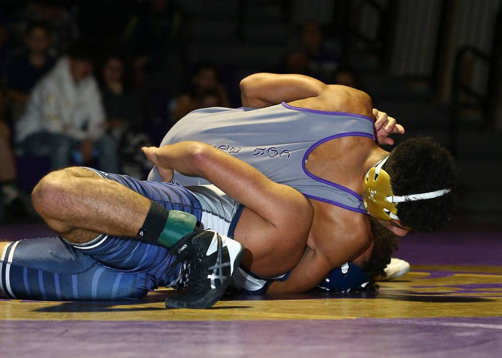 Oak Harbors Jamal Graham pins David Huerta.(Photo by John Fisken)