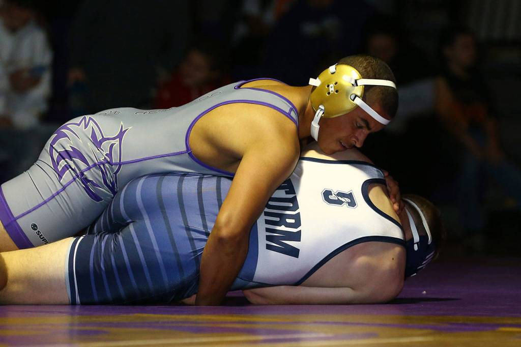 Oak Harbors Noah Hangan, top, tries to put Jason Retz on his back.(Photo by John Fisken)