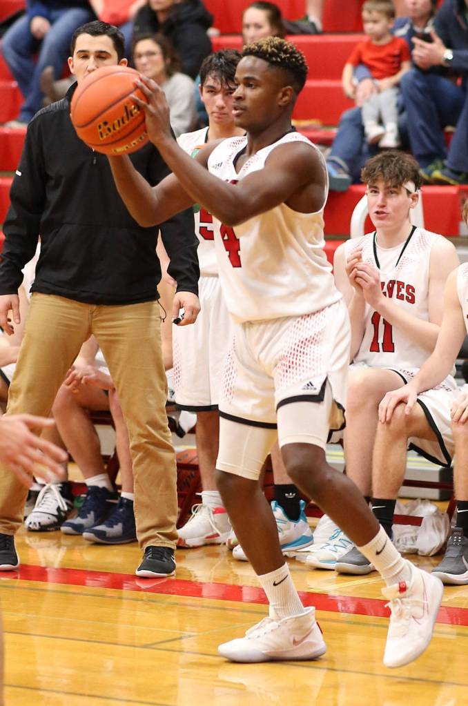 Jean Lund Olsen looks to run the offense for the Wolves.(Photo by John Fisken)