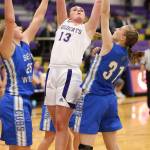 Payton Parks splits two Cub defenders for 2 points.(Photo by John Fisken)