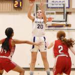 Grace Waite (20) sinks a three-pointer for Oak Harbor.(Photo by John Fisken)