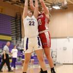 Oak Harbors Paige Fortin (22) fights M-Ps Madyson Baxter for a rebound. (Photo by John Fisken)