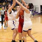 Oak Harbors Anna Jones, left, and Jasmine Ford double team Marysville-Pilchucks Alissa Edge.(Photo by John Fisken)