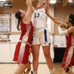 Payton Parks (13) scores over an M-P defender.(Photo by John Fisken)