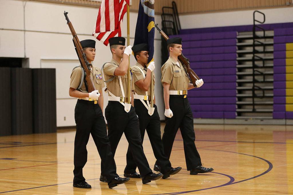 Lawrence Zapanta, left, Victor Zarate Jr., Anthony Herrera and Thomas Carman  color guard No. 1  marches to first place.(Photo by John Fisken)
