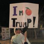 Debbie Legasse holds a sign on Main Street in Coupeville as part of a rally to support the presidential impeachment.