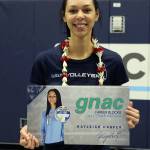 Kayleigh Harper shows off her award commemorating her conference career block record. (Photo by John Fisken)