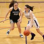 Grace Waite, right, dribbles by Shorewoods Molly Stamey.(Photo by John Fisken)
