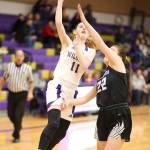 Olivia Waite (11) releases a runner over Molly Stamey.(Photo by John Fisken)